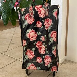 Vintage Avon bags with foldable wheels light material black with floral print
